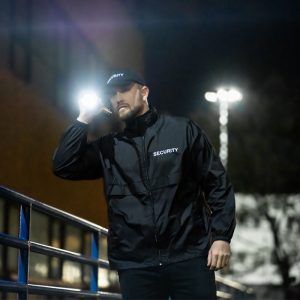 Security-Guard-Services-12 Security Guard holding his flashlight patrolling | Eastern Security in Altamonte Springs, FL